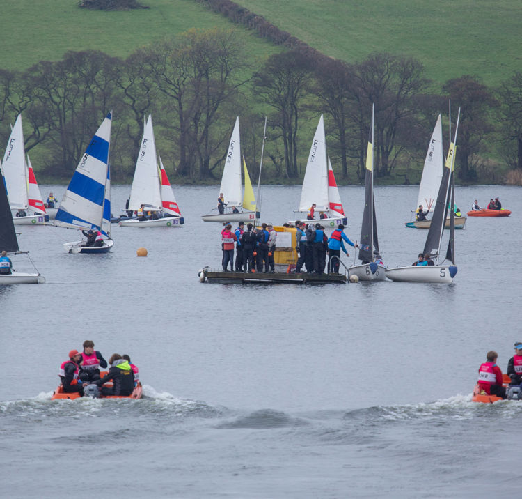Long shot of sailboats out on water