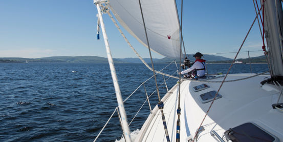 POV shot of sailboat on water looking out