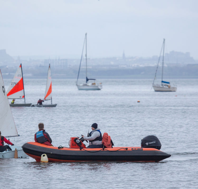 Dinghies sailing through a course