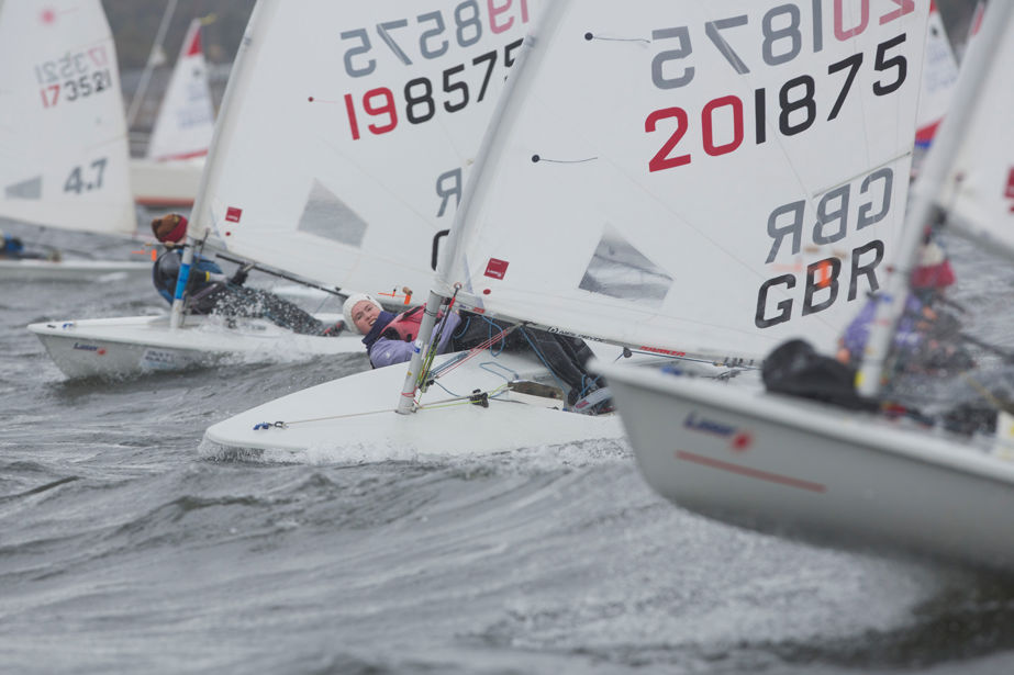 Close up of dinghies sailing through crashing water